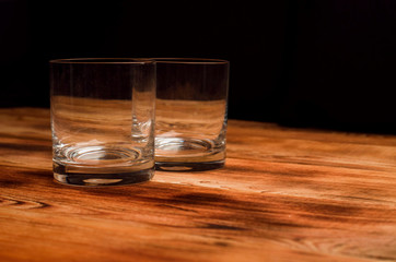 Glasses for whiskey on a wooden table
