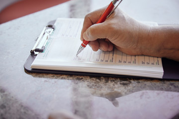 Person filling out a medical form