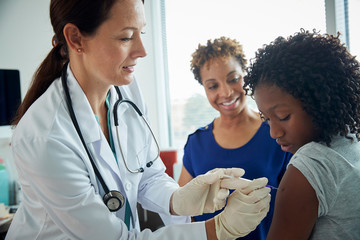 Doctor giving a patient a shot in the arm