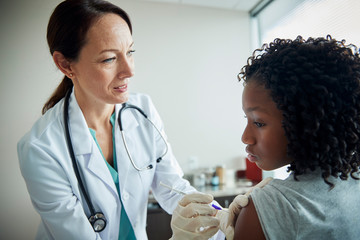 Doctor giving patient a shot in the arm