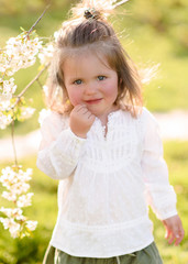 portrait of little girl outdoors in summer