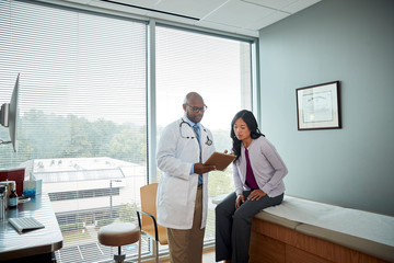 Doctor speaking with female patient