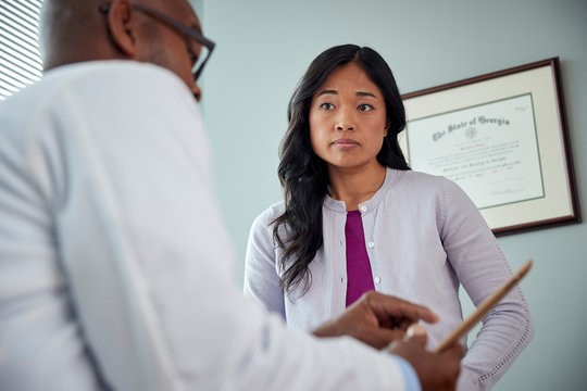 Doctor speaking with female patient