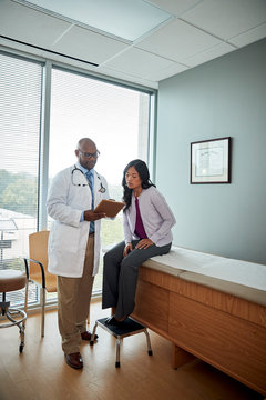 Doctor speaking with female patient