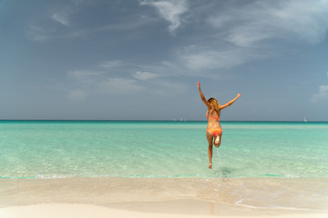 Fototapeta na wymiar Blonde girl on the Varadero beach, Cuba.