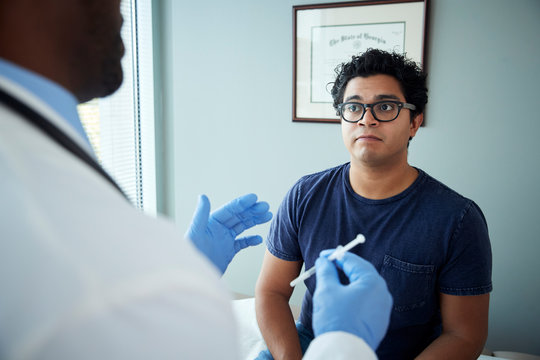 Doctor about to give injection to patient