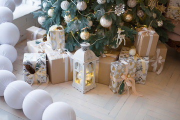 Christmas background. Interior room decorated in xmas style. No people. New year tree and gifts