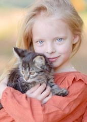 portrait of little girl outdoors in summer