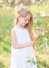 portrait of little girl outdoors in summer