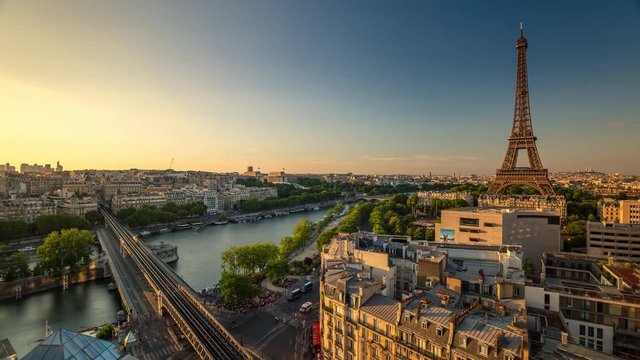 PARIS, FRANCE - JUNE 19, 2018: Eiffel Tower evening sunset timelapse from above. Fast movement.