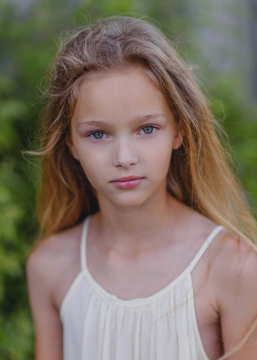 portrait of little girl outdoors in summer