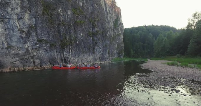 Epic Rafting Two Orange Boat on Shallow Mountain Forest Zilim River in Ural Mountains, Russia at summer sunny day - Aerial view