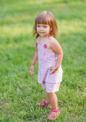 portrait of little girl outdoors in summer