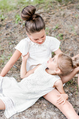 Fototapeta premium Portrait of two girls in the woods girlfriends