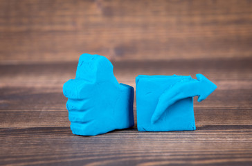 like and share icon from plasticine. abstract social media and internet background