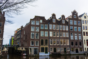 Fototapeta na wymiar Traditional houses in the canals of Amsterdam, Netherlands