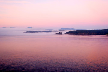 Islands in misty pink sunrise