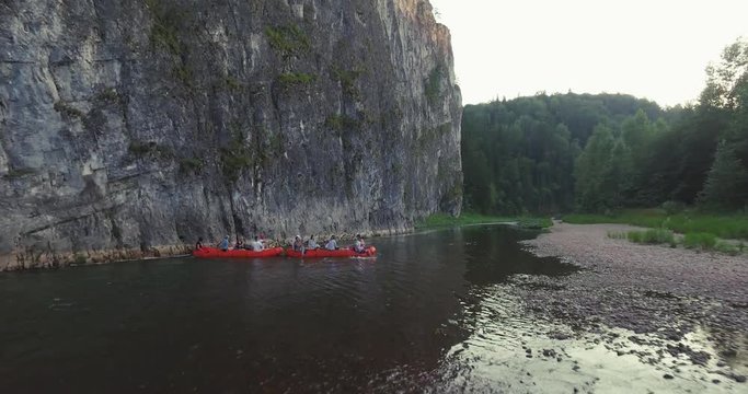 Epic Rafting Two Orange Boat on Shallow Mountain Forest Zilim River in Ural Mountains, Russia at summer sunny day - Aerial view