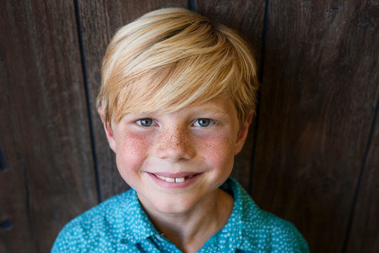 Portrait of a smiling boy with freckles