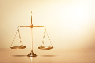 Law scales on table background