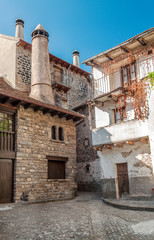 Facade of ancient house decorated with flowers