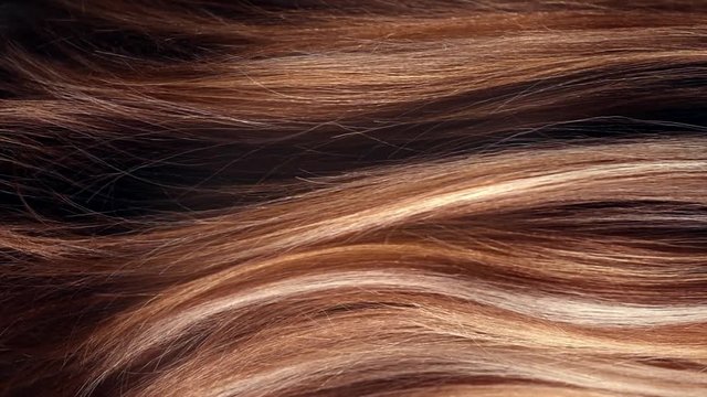 Hair. Beautiful healthy long smooth flowing brown hair closeup texture. Dyed straight hair background. Slow motion. 3840X2160 4K UHD video footage