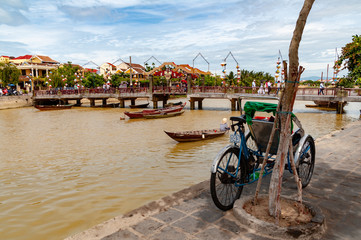 Hoi An River Boat with Tricycle in the foreground