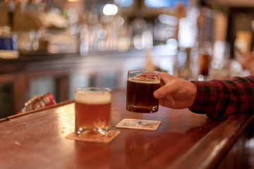 Man sitting at counter having a beer