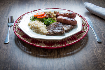 Brazilian food dish - barbecue, rice and beans