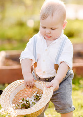 portrait of a Little boy playing in summer nature