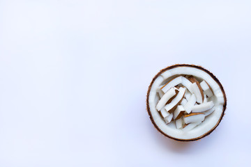 Pieces of coconut in half coconut on white background.