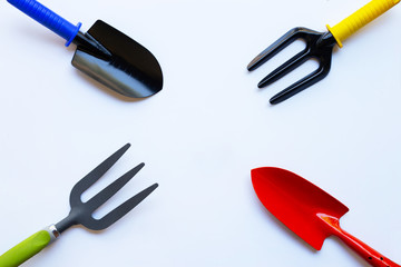 Garden shovel and fork isolated on white background