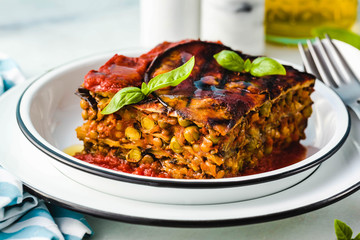 gluten free vegan lasagna. from grilled eggplant, green peas, lentils and vegetables. delicious healthy comfort food for the whole family for the holidays. italian parmigiana
