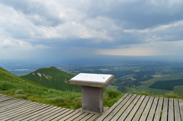 A magnificent panorama and viewpoint  from the mountain range of Sancy with a thunderstorm, in Auvergne, France. National Park of the Auvergne volcano