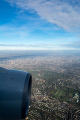 Vertical View of Landscape Taken from an Airplane in Fligth and Close Up of an Engine