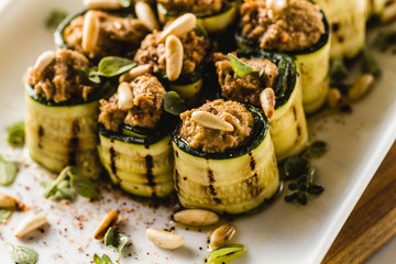 vegan appetizer of grilled zucchini and olive pate on a festive table. healthy food for a family or a party