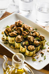 vegan appetizer of grilled zucchini and olive pate on a festive table. healthy food for a family or a party