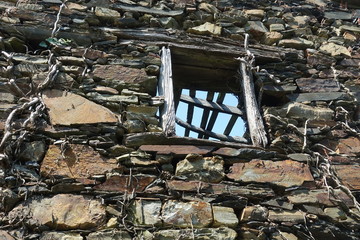 Derelict schist building