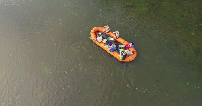 Epic Rafting Two Orange Boat on Shallow Mountain Forest Zilim River in Ural Mountains, Russia at summer sunny day - Aerial view