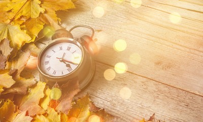 Retro alarm clock on wooden background