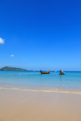 Long tail boats at the beautiful beach in Phuket, Thailand