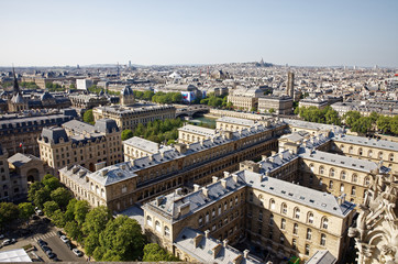 Fototapeta na wymiar Paris, France - May 6, 2018: Paris Panorama with Basilica Sacre Coeur on the background. View from Cathedral Notre Dame de Paris