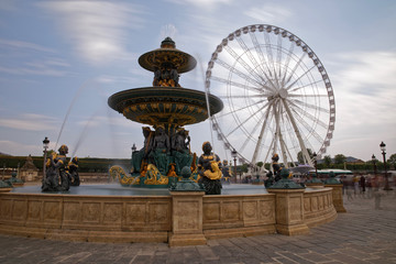 Paris, France - May 16, 2018: Fountain and Ferris Wheel at the Place de la Concorde in Paris
