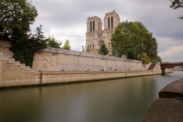 Fototapeta na wymiar Paris, France - July 5, 2018: Notre Dame de Paris and Cite island captured from the opposite bank of Seine river