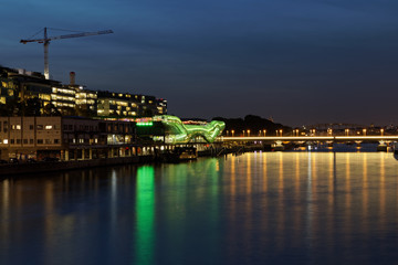 Paris, France - October 31, 2017: Cite de la Mode et du Design, The City of Fashion and Design, on the banks of the Seine River. Colourful original green building