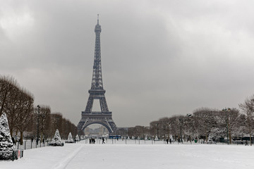 Paris, France - February 7, 2018: The wall for peace in the foreground with the eiffel tower under the snow in the background
