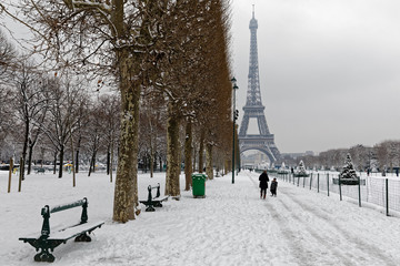 Paris, France - February 7, 2018: The wall for peace in the foreground with the eiffel tower under the snow in the background