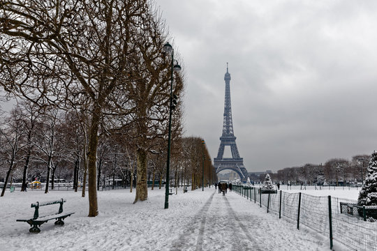 Paris, France - February 7, 2018: The wall for peace in the foreground with the eiffel tower under the snow in the background
