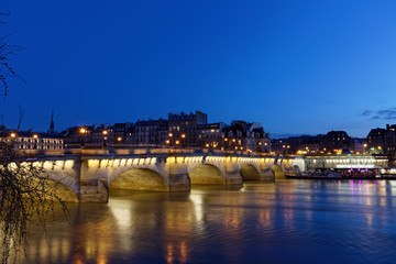 Fototapeta premium Paris, France - February 18, 2018: View of Pont Neuf, old bridge in Paris by night
