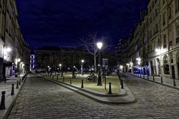 Paris, France - February 18, 2018: Place Dauphine by night in Paris